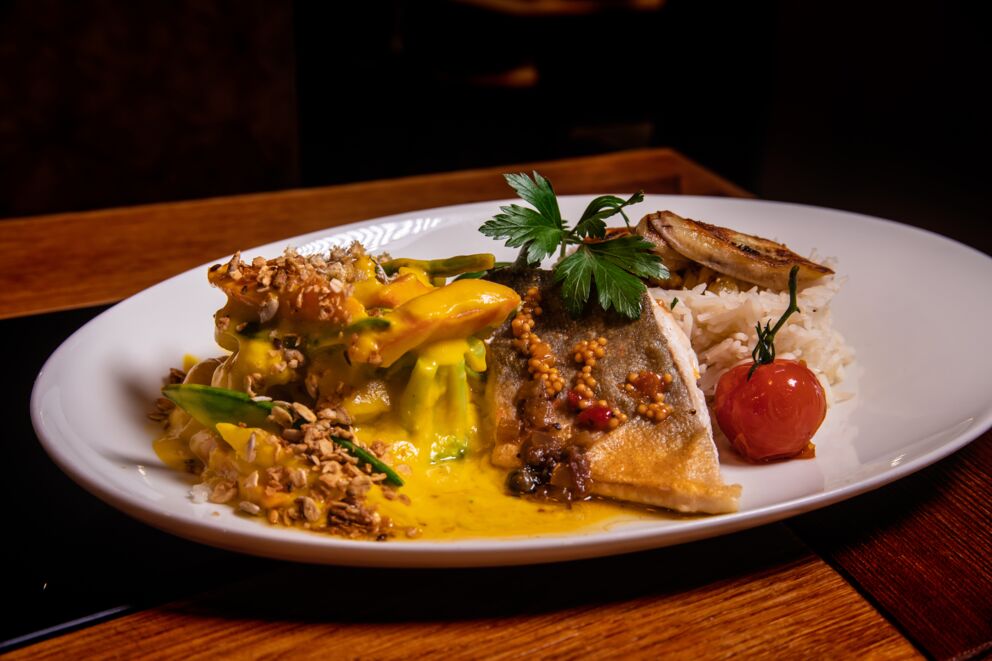 Curry with rice, fish and vegetables at the Benediktus Restaurant in Salzkammergut